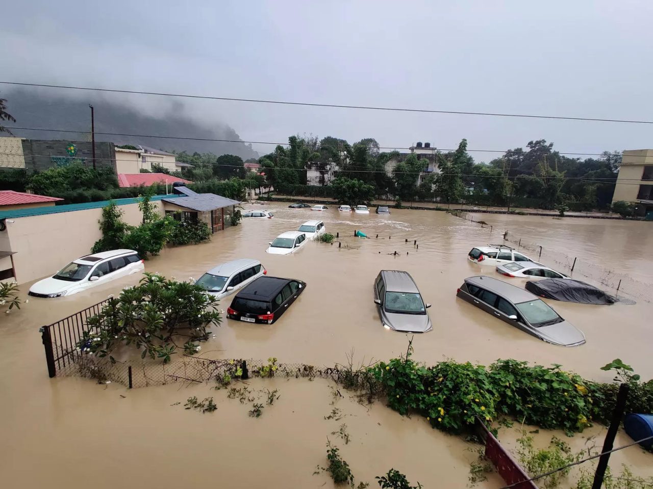 yearenders 2021 environment uttarakhand submerged cars are seen at a flood