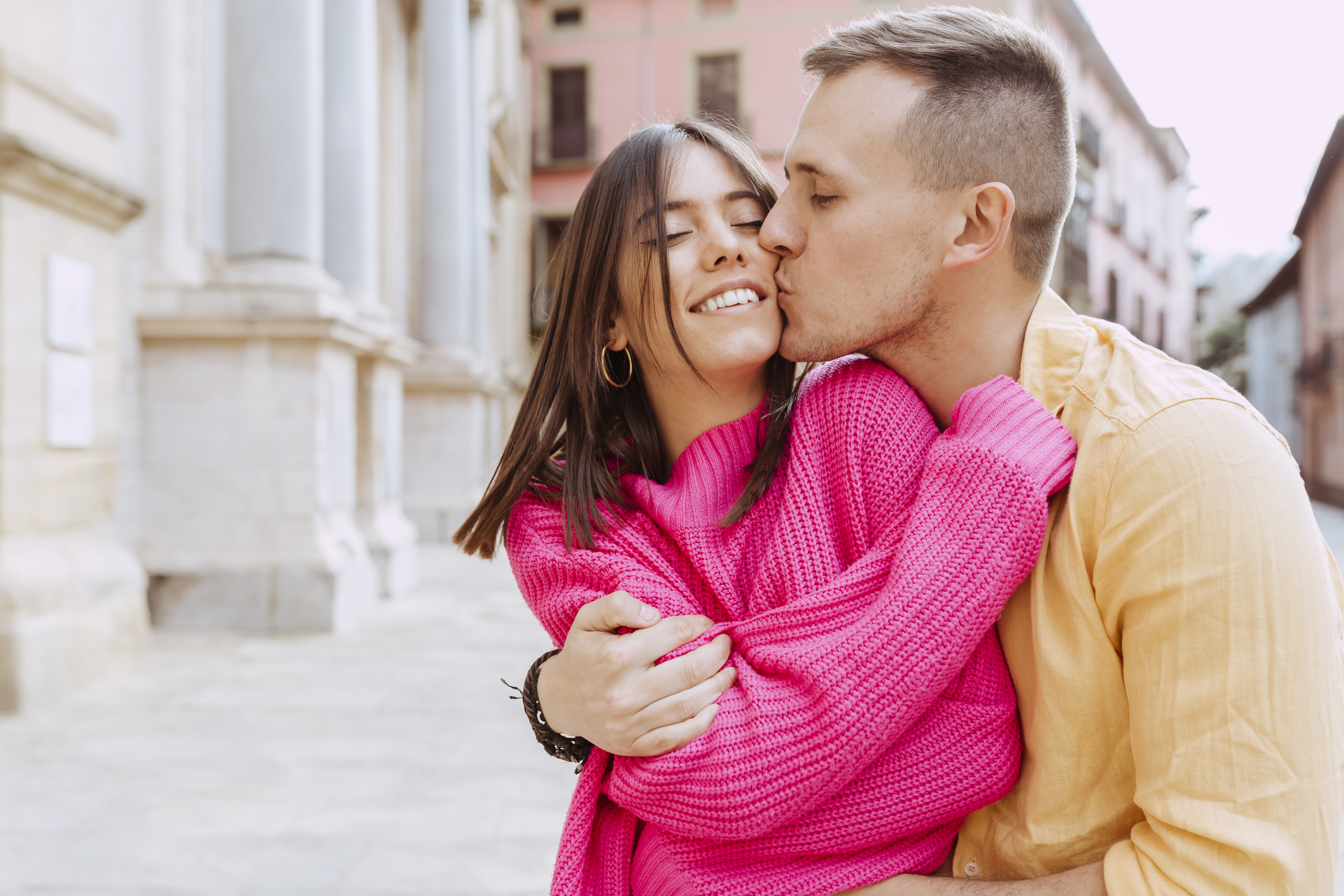 happy smiling couple hugging and kissing on city s 2024 03 21 18 26 30 utc