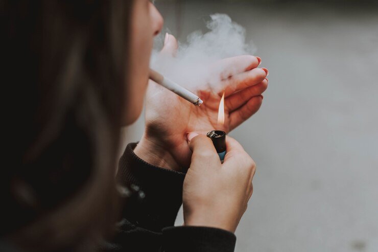 selective closeup shot female lighting up cigarette with lighter 181624 17164