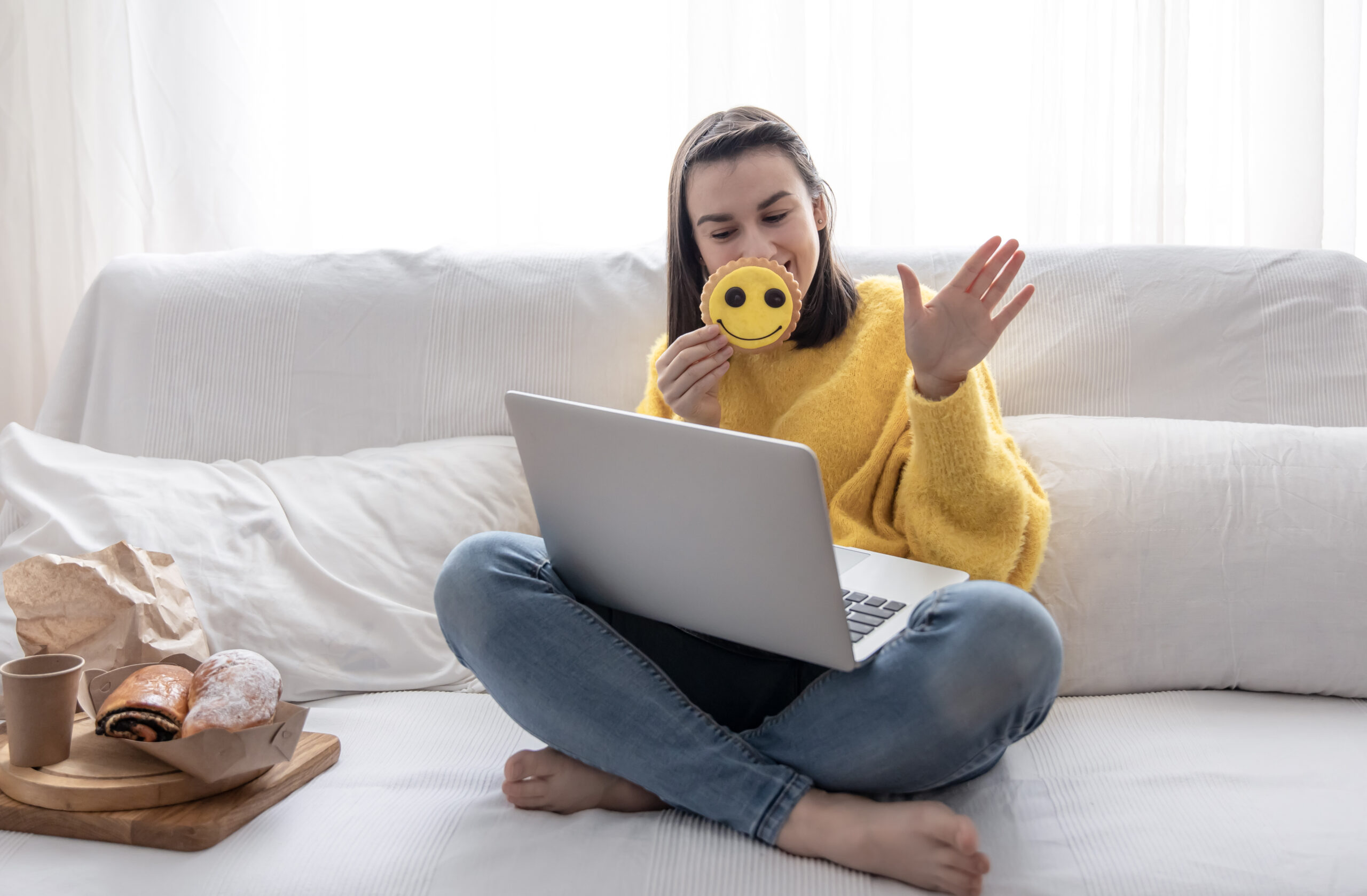 girl in a yellow sweater sits on the couch in fron 2023 11 27 05 18 37 utc scaled