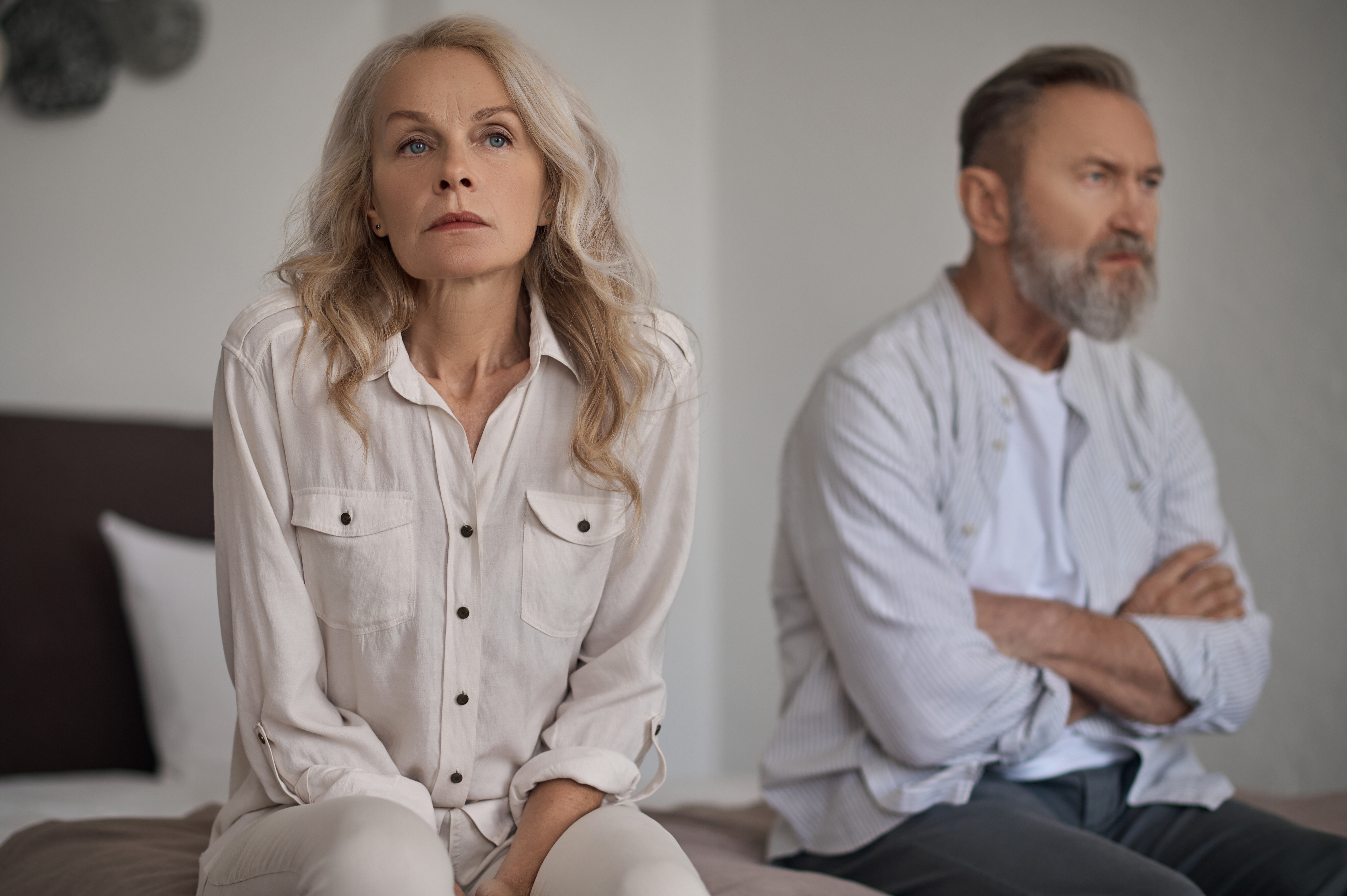 unhappy mature couple sitting apart in silence 2023 11 27 05 13 56 utc