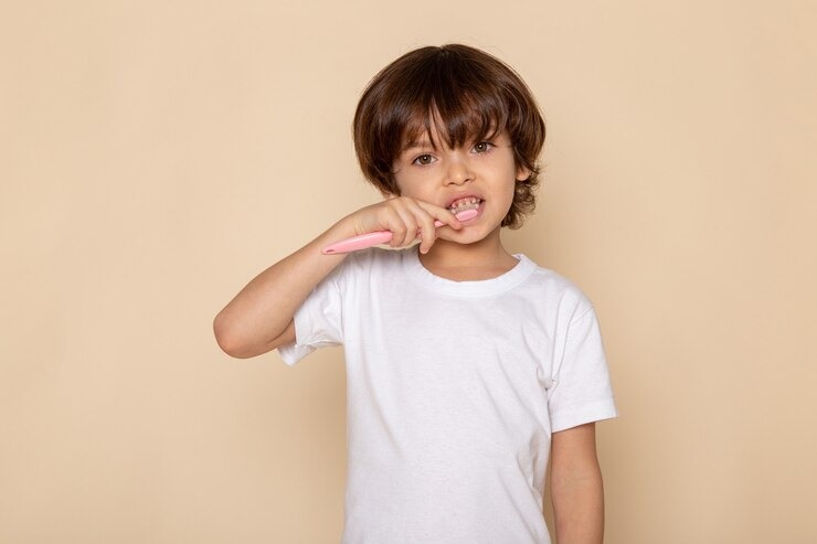 What causes white spots on children's teeth?