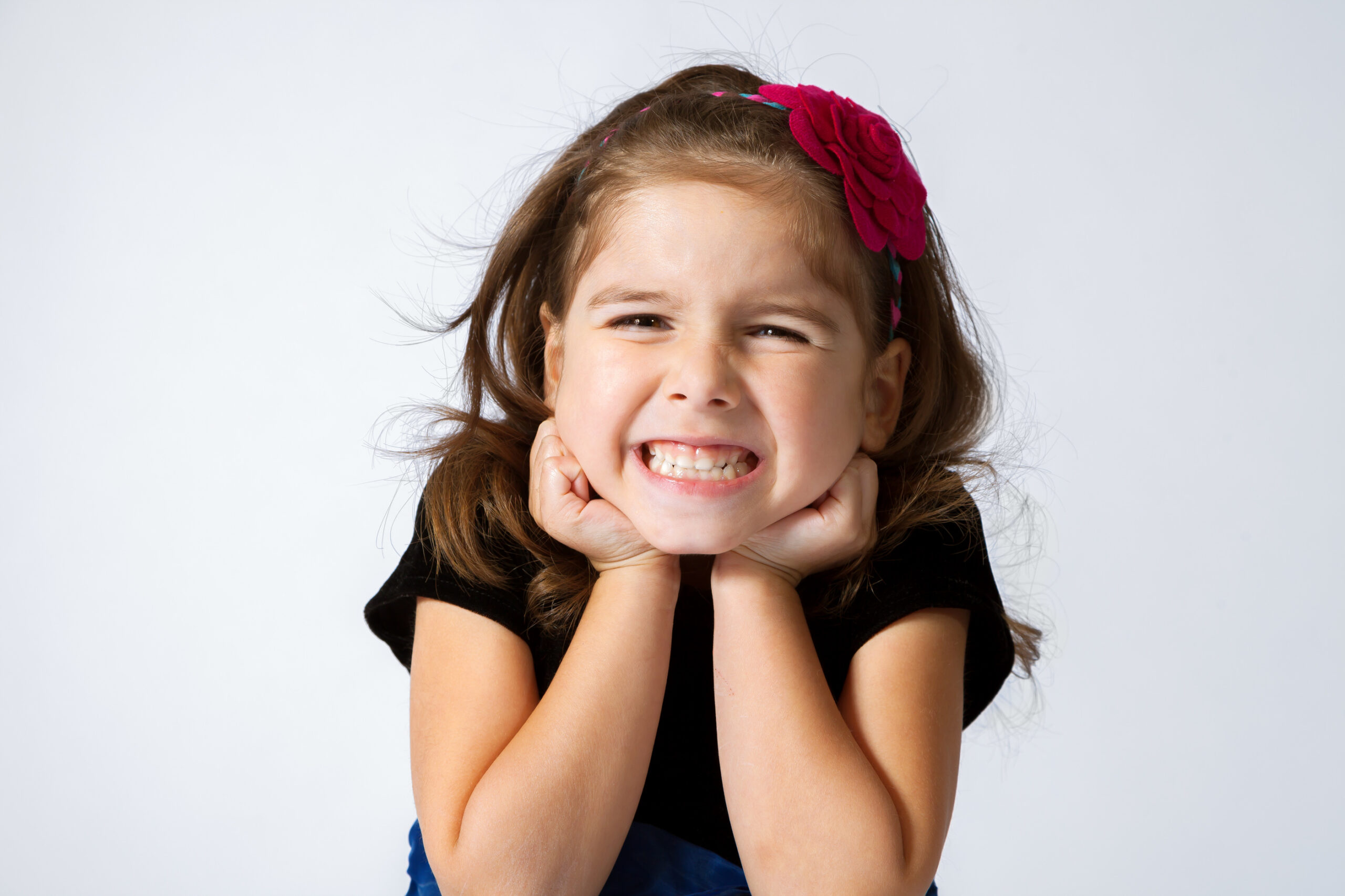 What causes white spots on children's teeth?