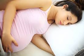 Is it dangerous for a pregnant woman to sleep on her back