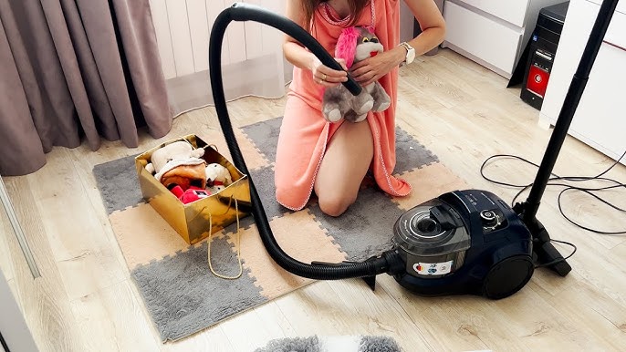 Using a vacuum cleaner to clean toys