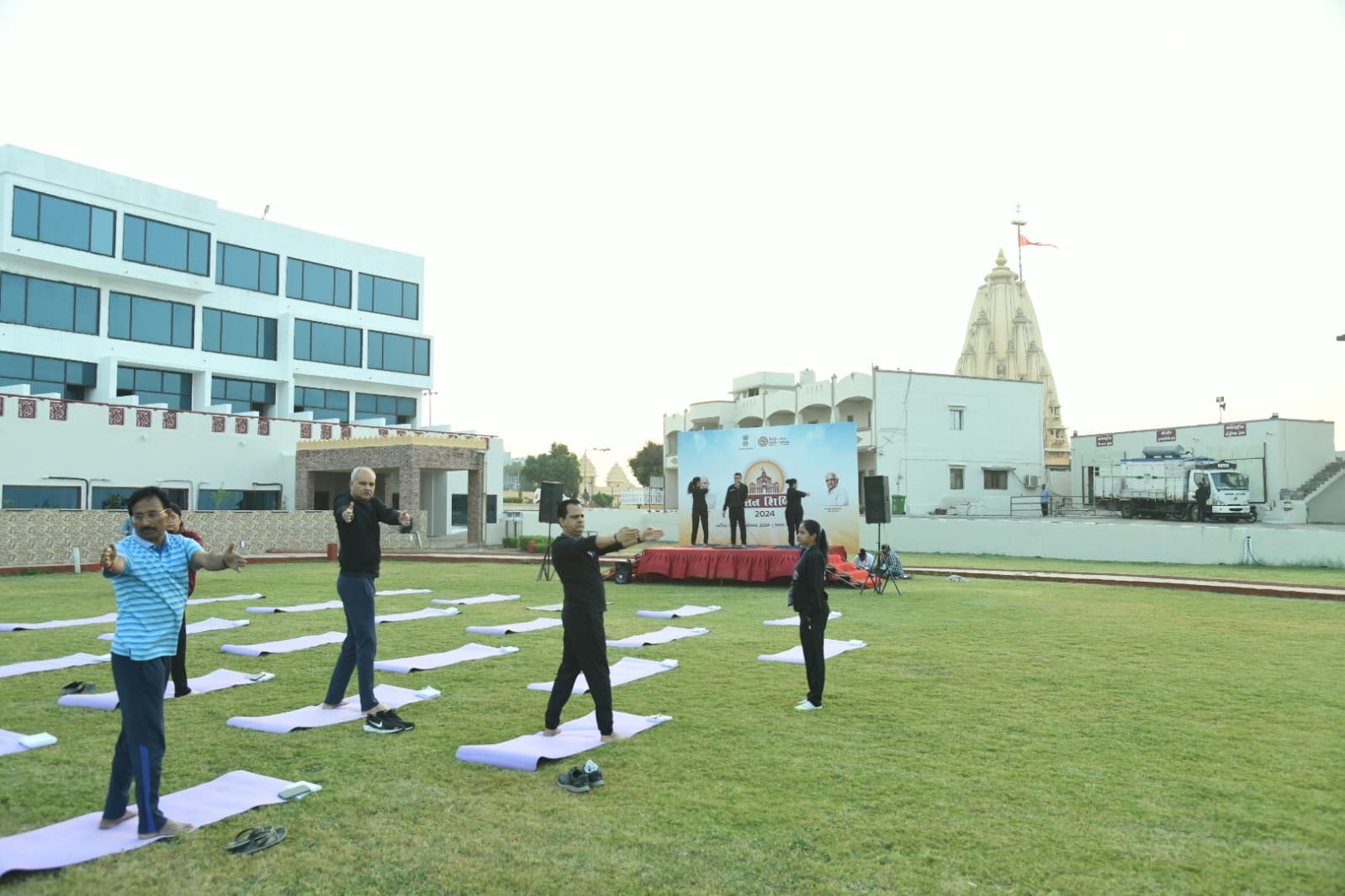 Officials begin the second day of the Chintan Shivir by doing yoga and pranayama on the beach of Somnath